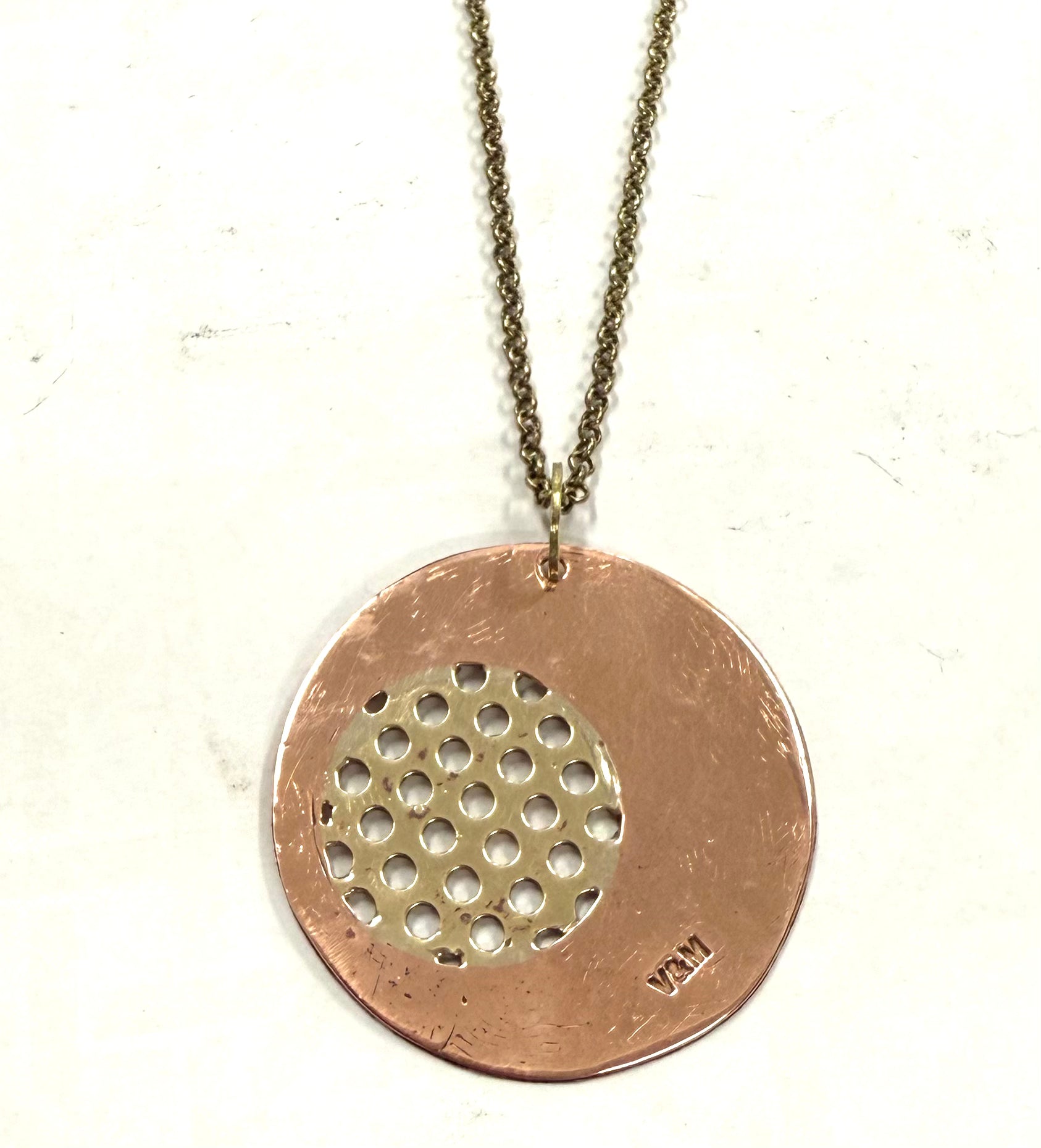 Copper and brass ottone in circle pendant