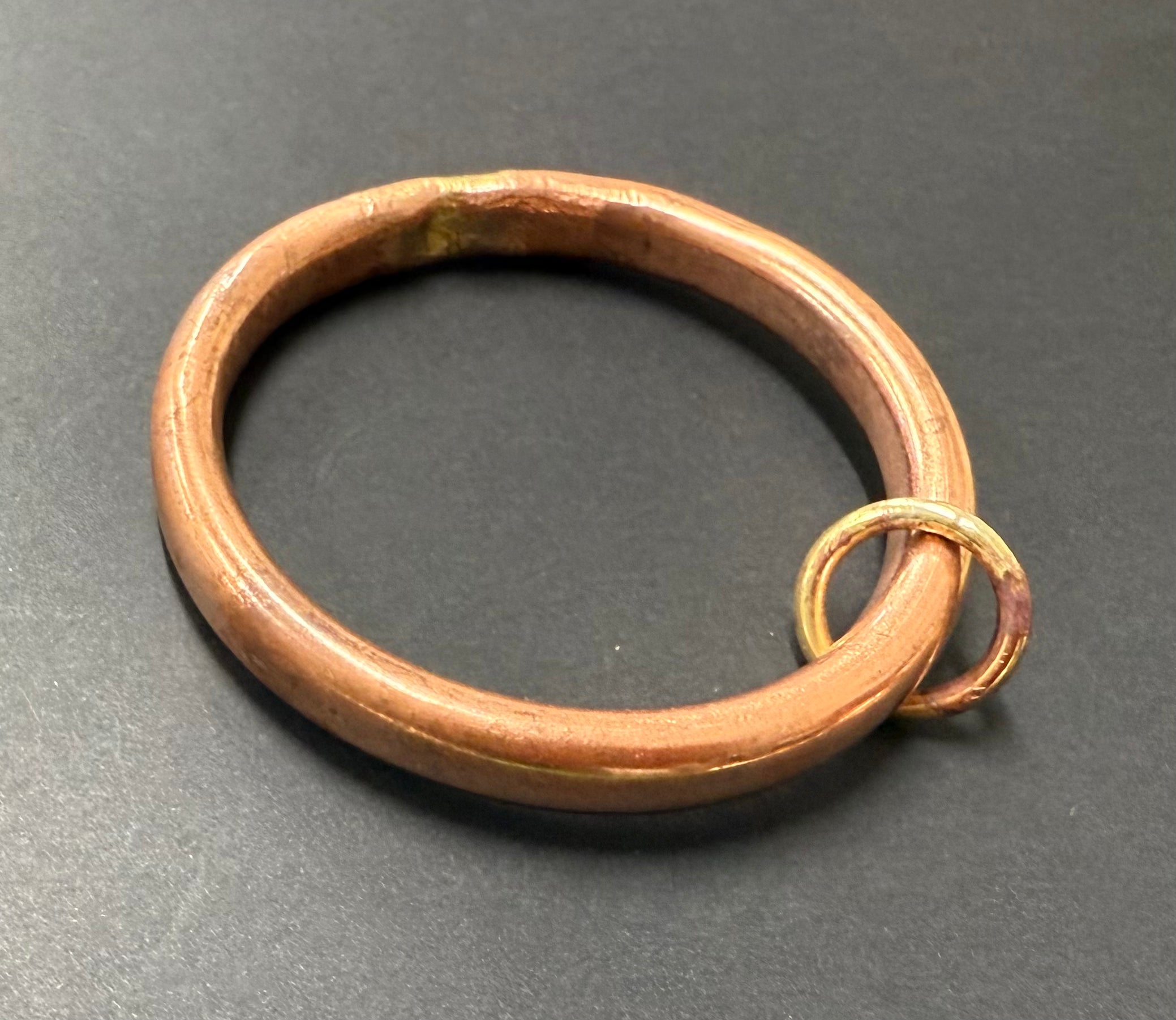 Copper anvil bangle with brass loop