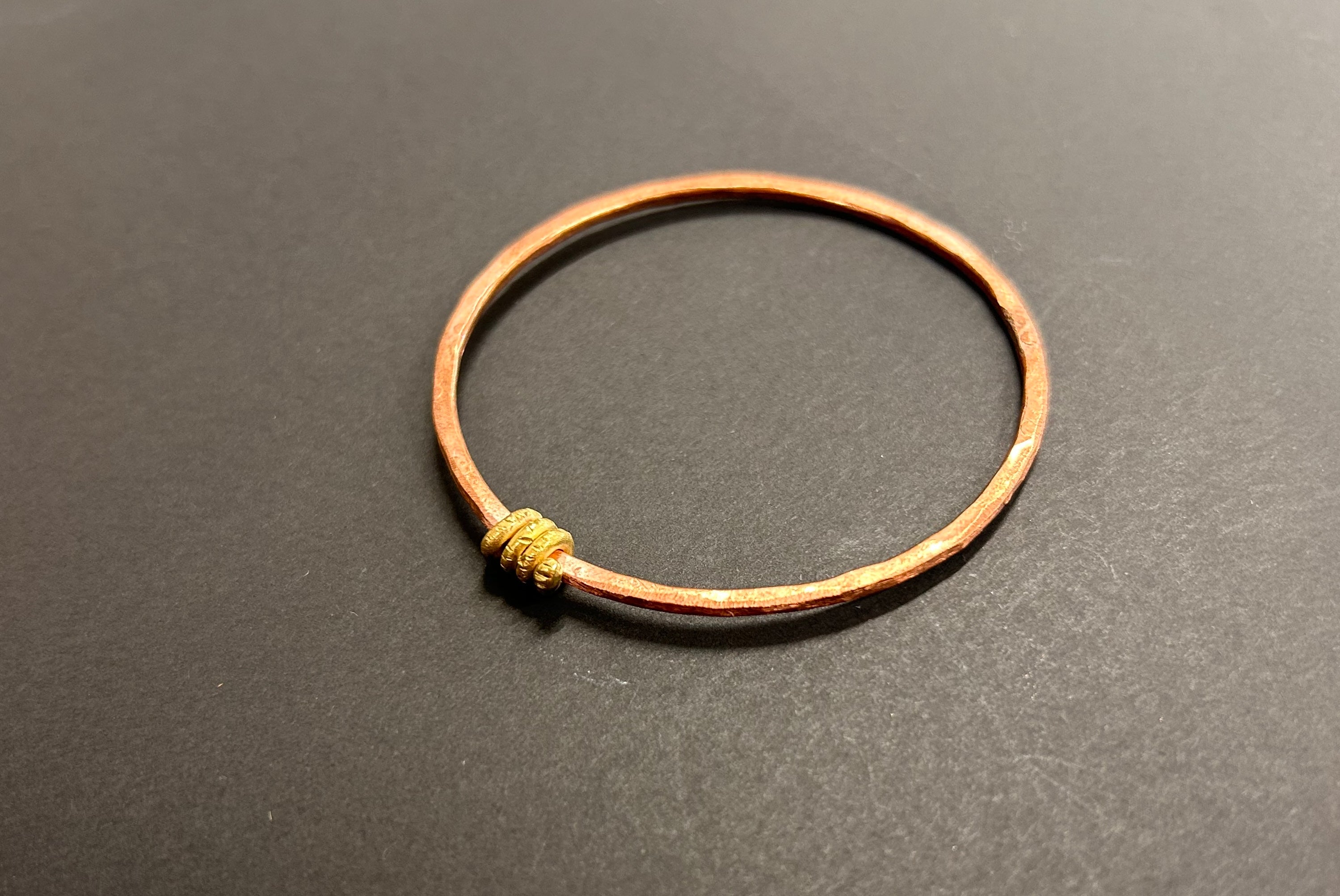 Thin copper bangle with brass wrapping