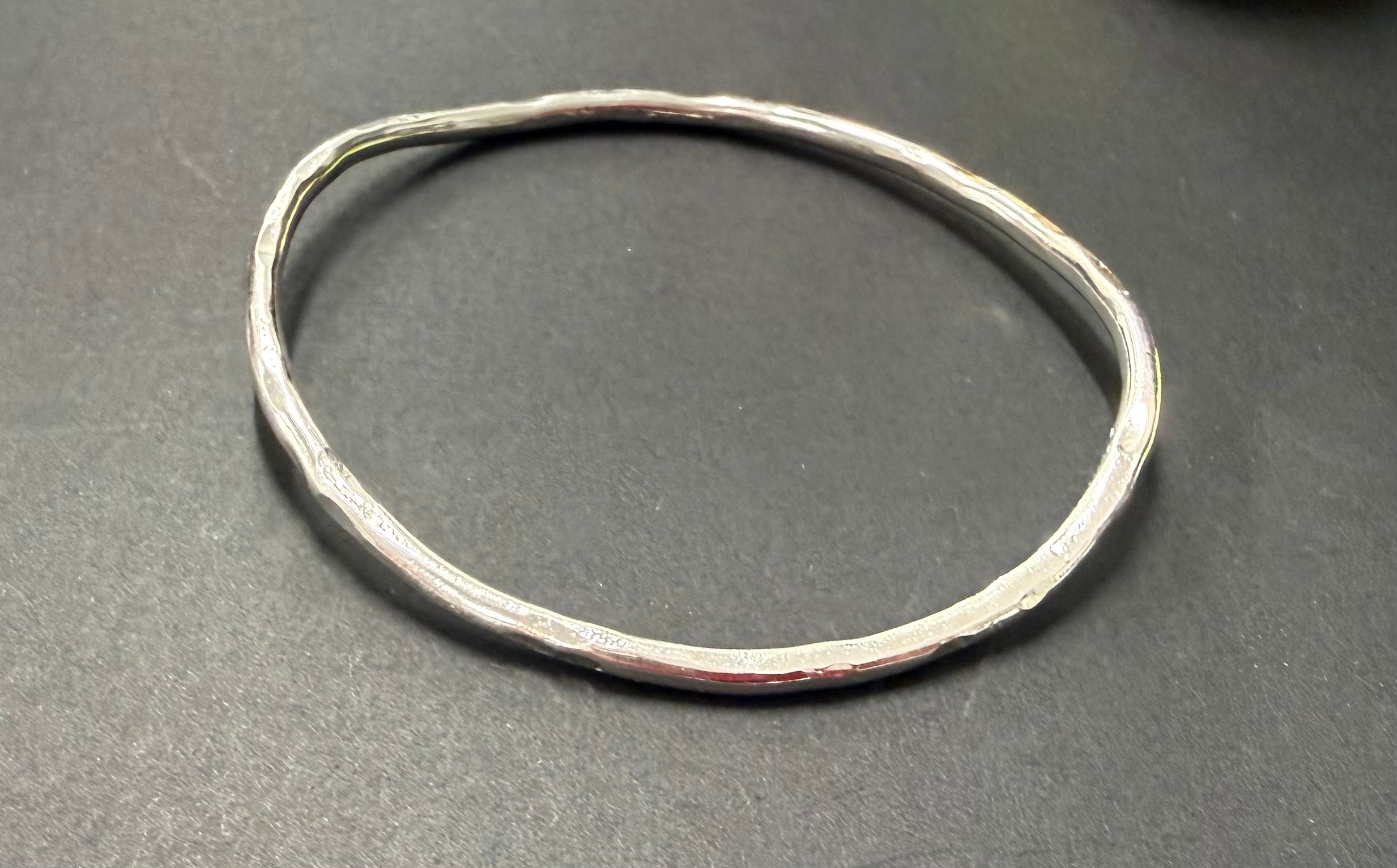 Thin silver twist bangle