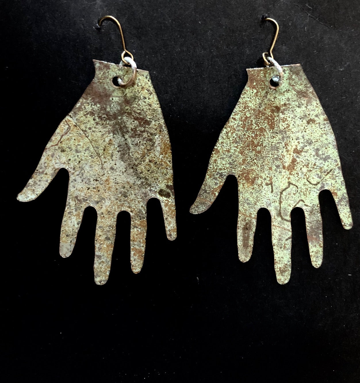 Church roof hands big earrings