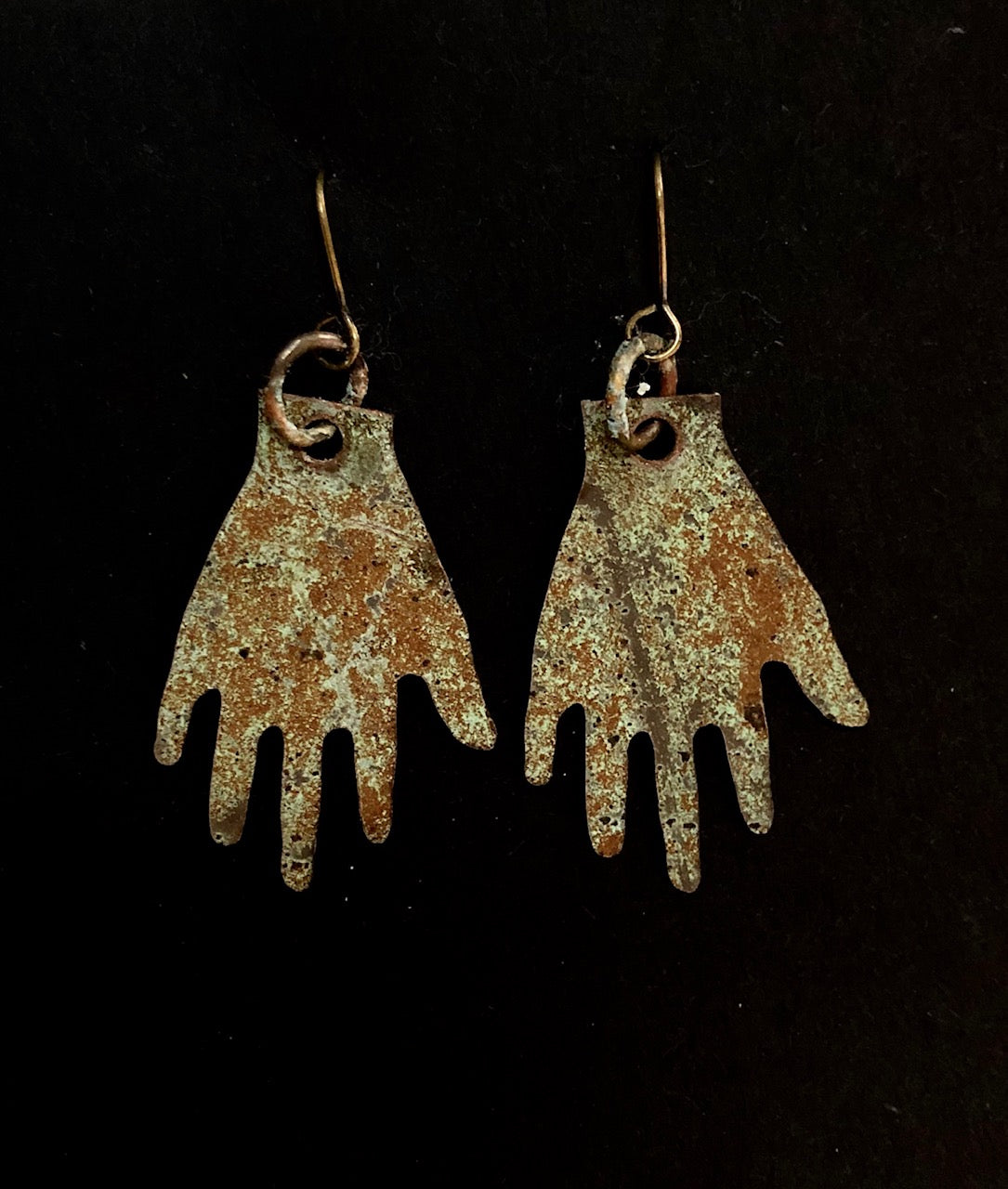 Church hands small earrings