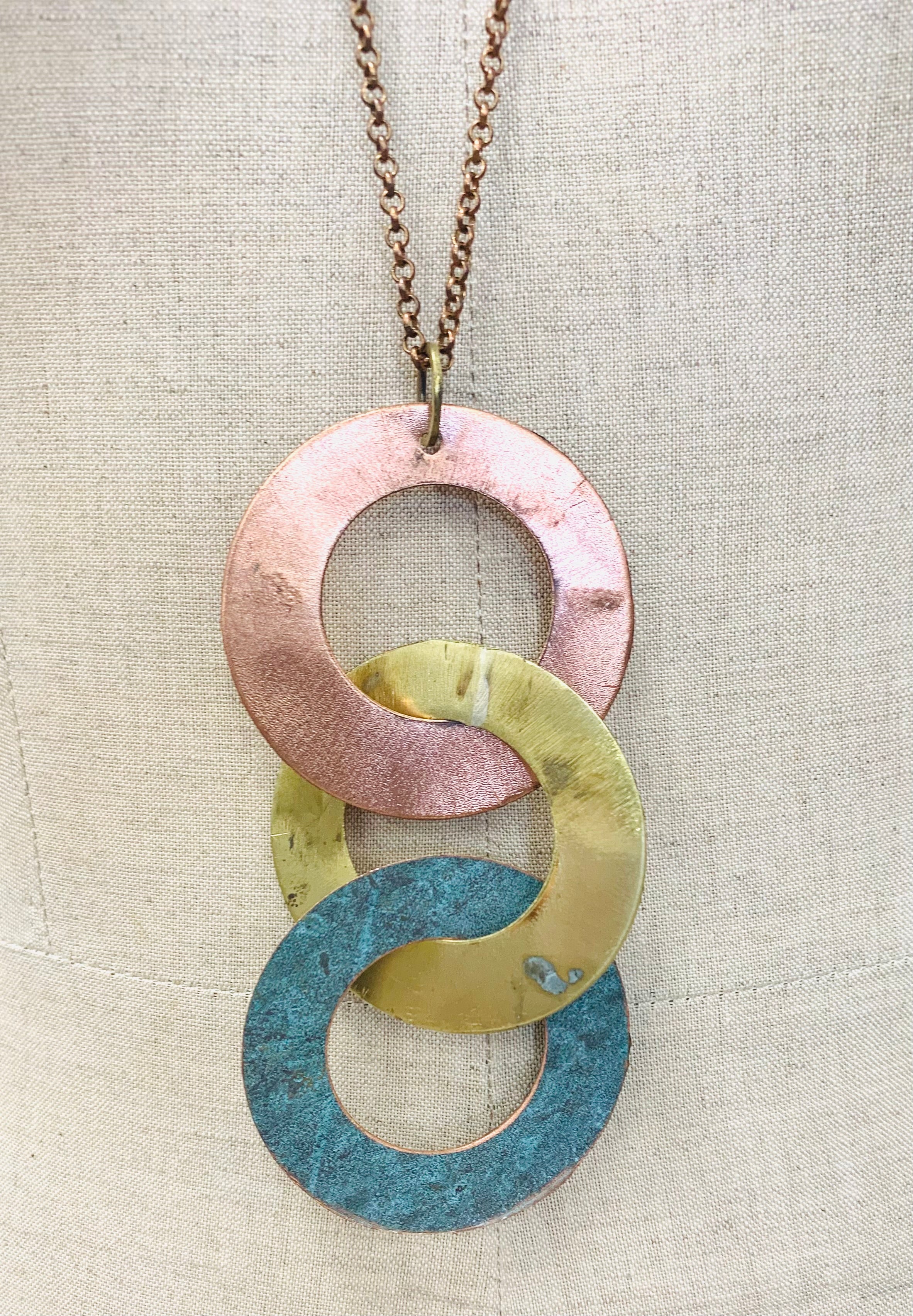 Interlinking large disc mixed metal pendant