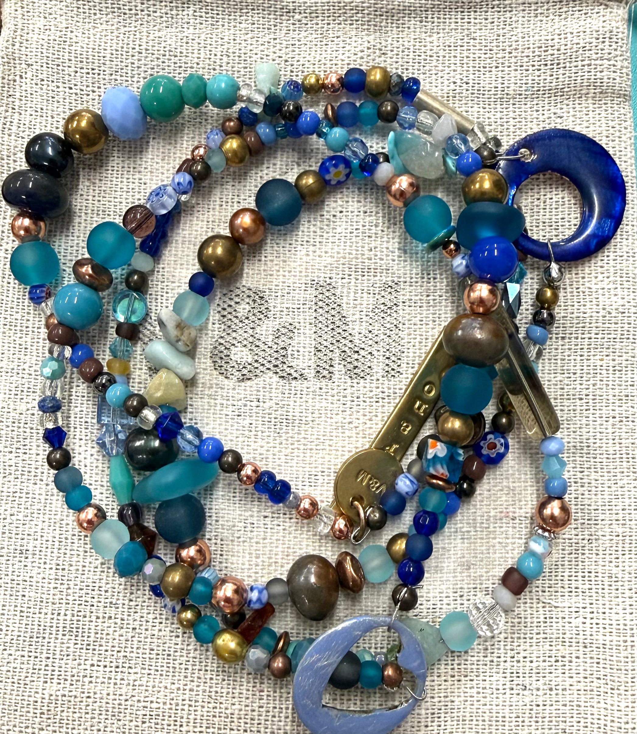 Long glass and metal beads