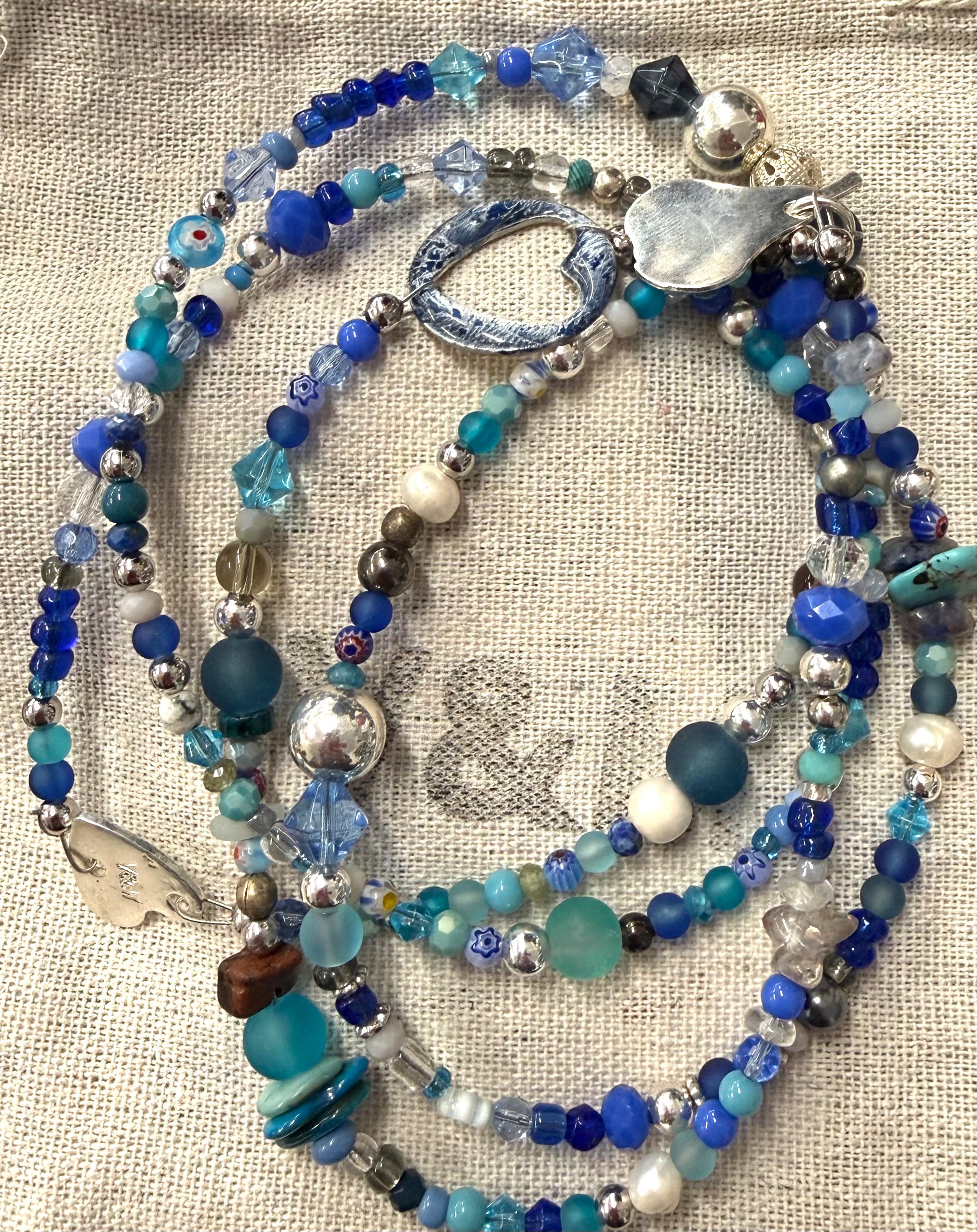 Long glass and metal beads
