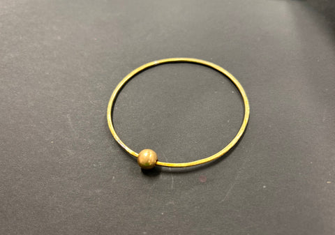 Thin brass bangle with bead