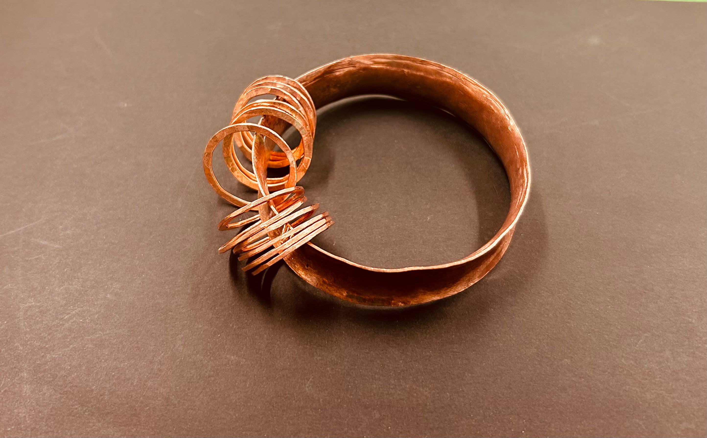 Concave copper bangle with hoops