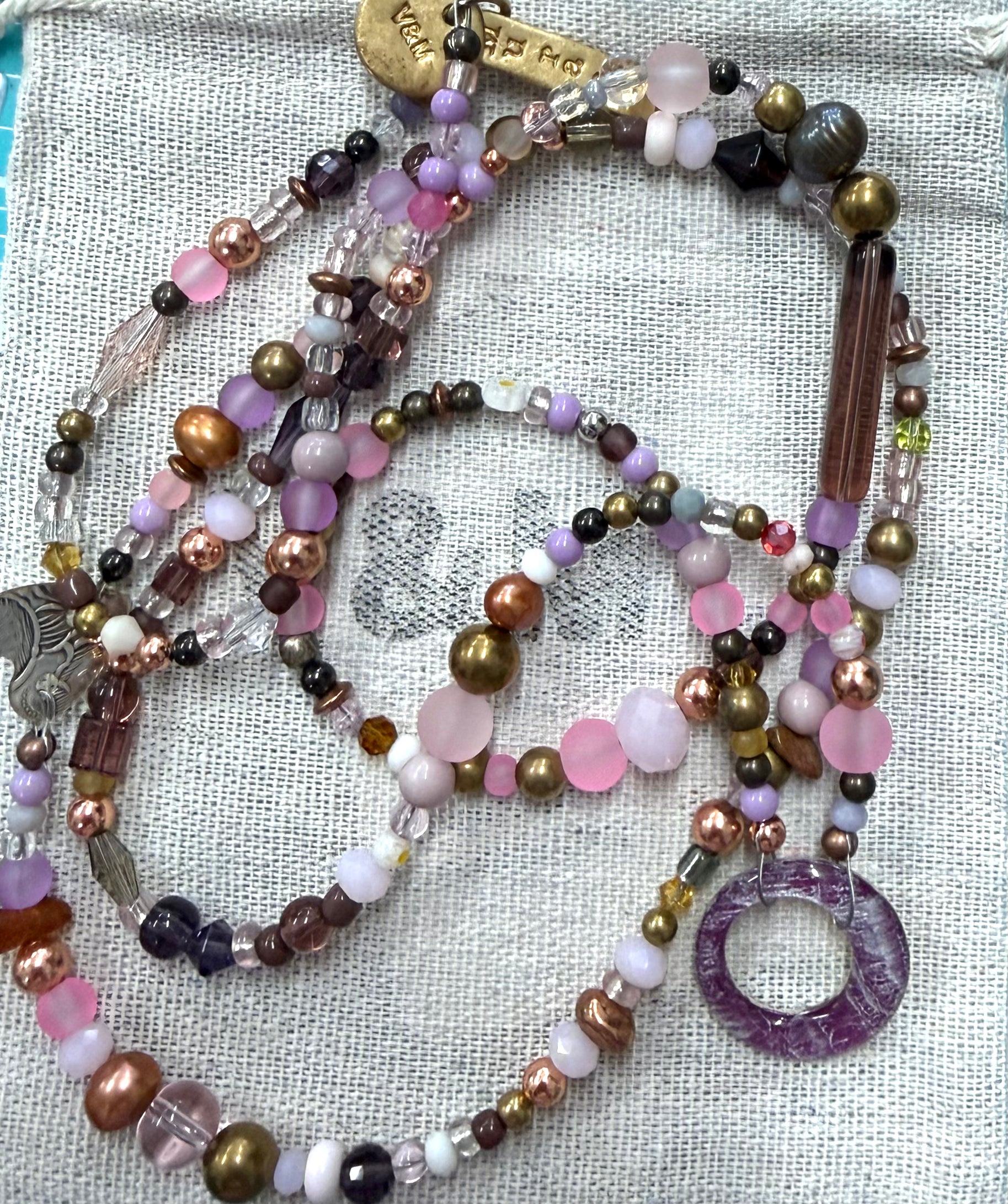 Long glass and metal beads