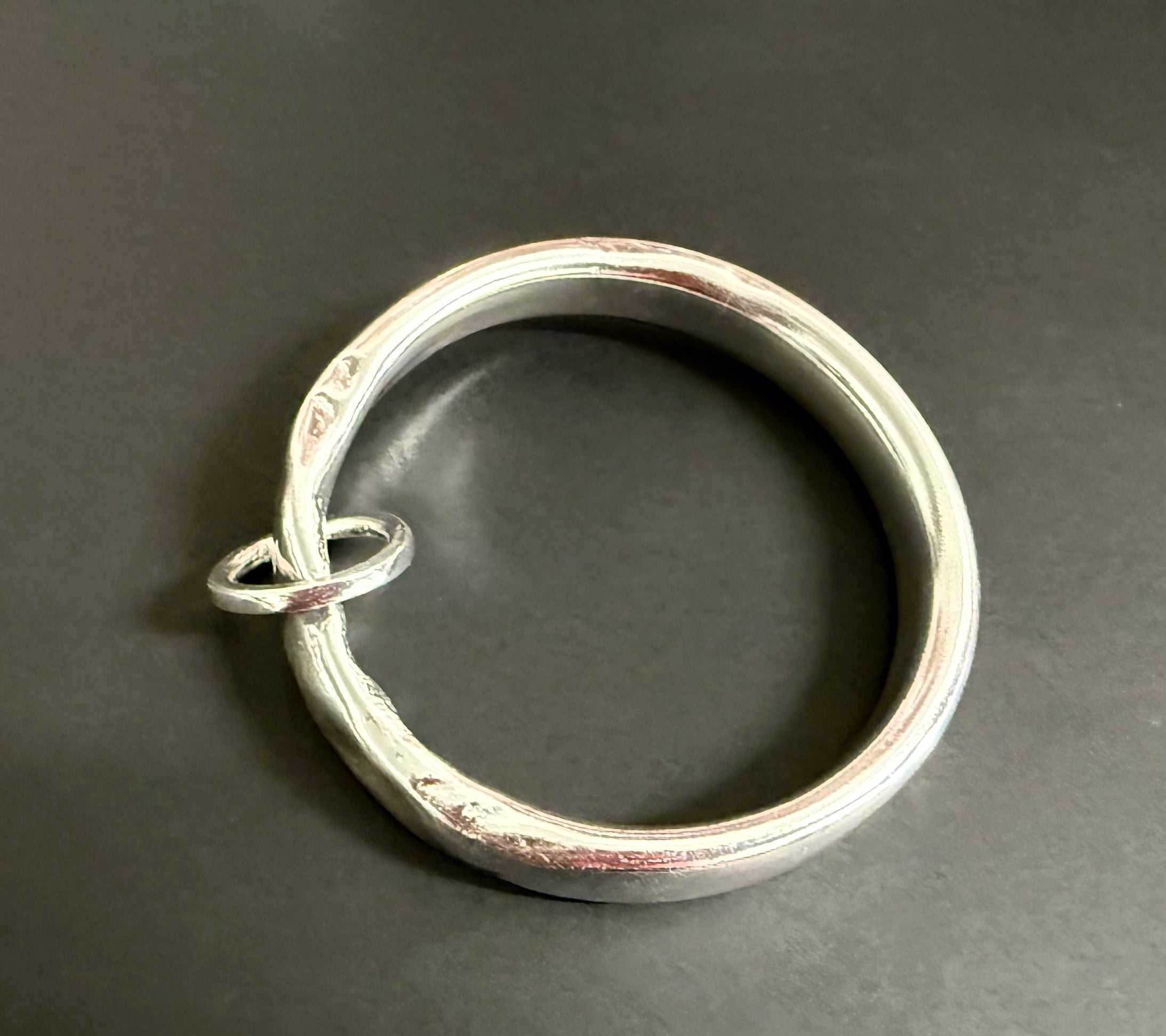 Silver anvil bangle with hoop