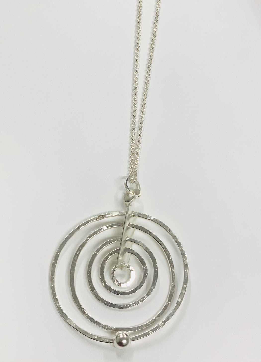 Concentric circles silver pendant