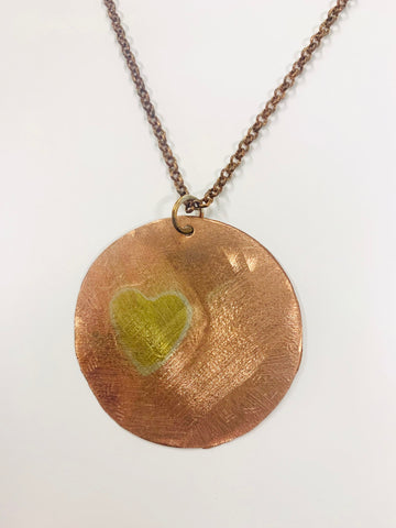 Copper and brass heart in circle pendant