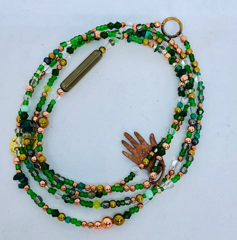 Long green glass and metal beads