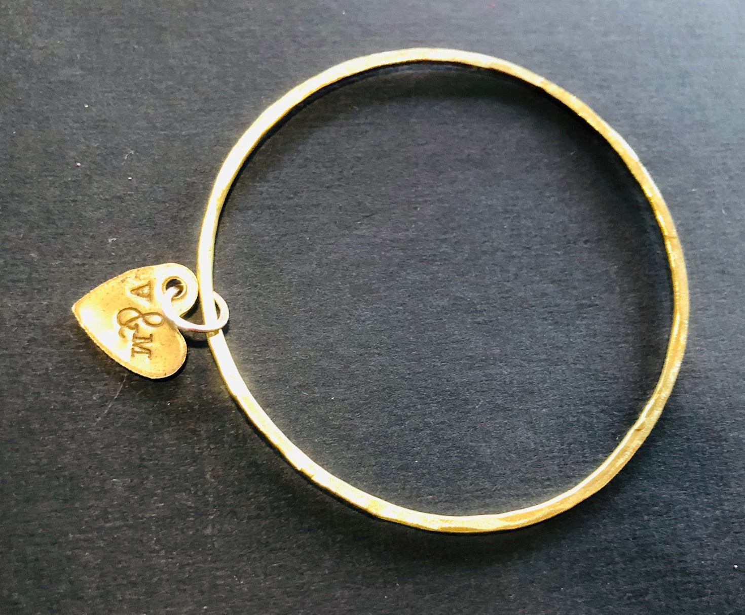 Thin brass bangle with heart
