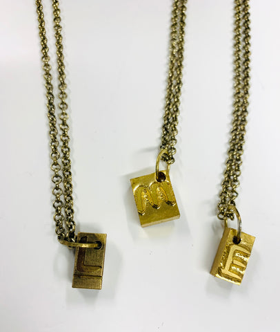 Printers type brass pendants